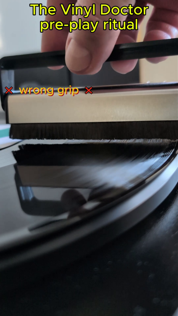 Holding a carbon fibre record brush in wrong grip.