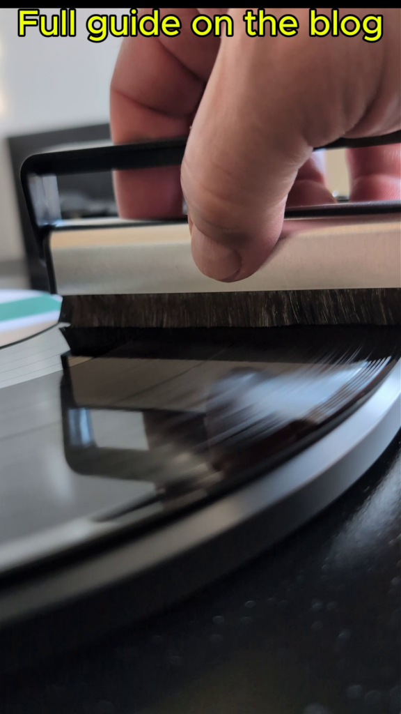 Lowering a carbon fibre brush gently onto a spinning vinyl record