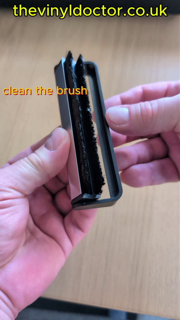 Cleaning the carbon fibre brush after use.