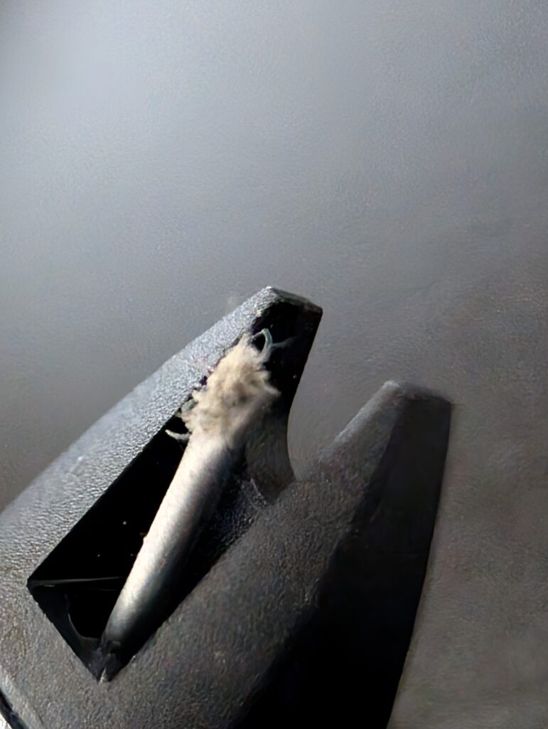 Ortofon M10 stylus heavily contaminated after playing one side of an uncleaned borrowed record.