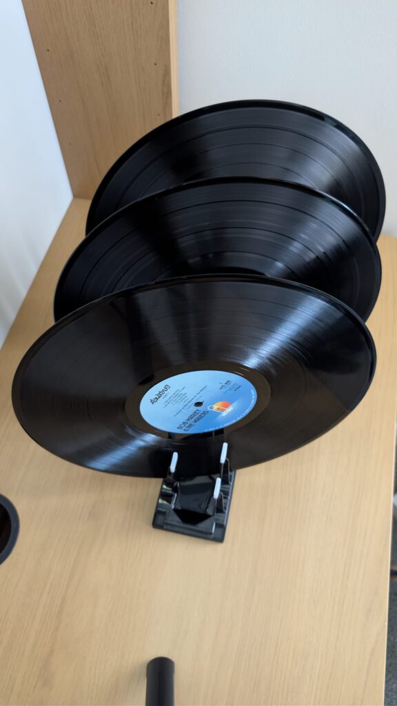 Vinyl records drying vertically after ultrasonic cleaning.